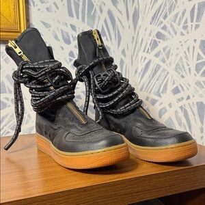 Nike Black Lace-Up Women's Boots with Gold Accents